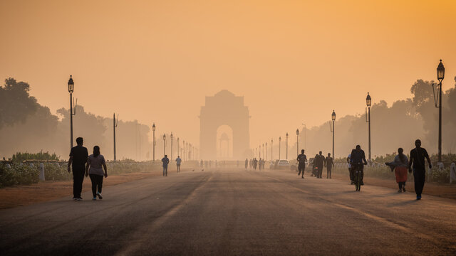 Silhouette of triumphal arch architectural style war memorial during hazy morning. Pollution level rises and causes smog in autumn season due stagnant winds.