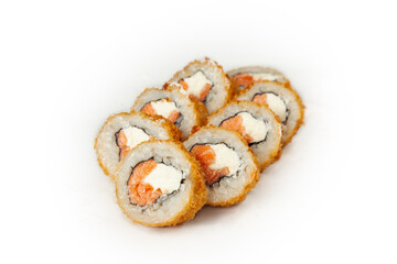 Tempura roll with salmon on a white plate, classic Japanese sushi. Traditional Japanese food with maki. Delicious pieces of sushi. For the restaurant menu. copyspace