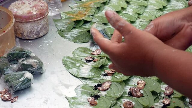 Preparation paan combining betel leaf with betel nut or areca nut.