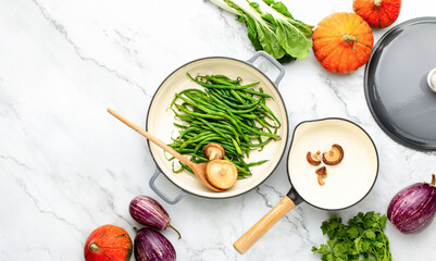 Fall culinary background with modern cast iron kitchenware