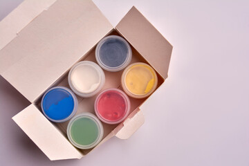 gouache in the package on a white background. View from above