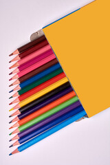 colored pencils packaged on a white background