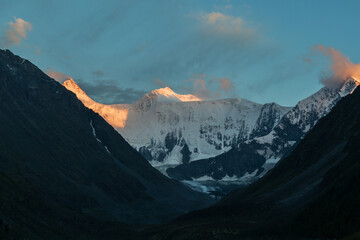 Glacier on Mount Belukha in the rays of the setting sun. Mountain Altai.