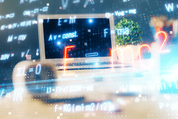 Desktop computer background and formula hologram writing. Double exposure. Education concept.