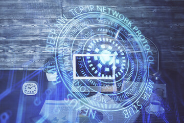 Double exposure of laptop computer and technology theme hologram. Concept of freelance work.