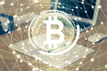 Double exposure of blockchain theme hologram and table with computer background. Concept of bitcoin...