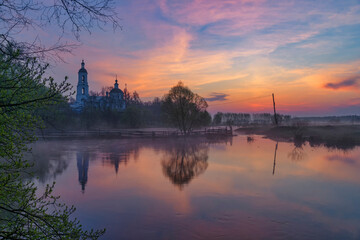 Spring sunrise and reflection of river flood 