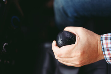 Fototapeta premium accelerate, auto, automobile, automotive, background, black, button, car, change, close, close-up, closeup, clutch, cockpit, concept, control, design, detail, drive, engine, fast, first, forward, gear