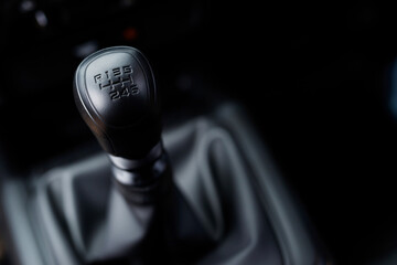 6 speed manual gearbox leather handle in a modern car.