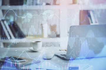 Forex market chart hologram and personal computer background. Multi exposure. Concept of investment.