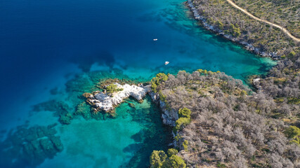 Naklejka na ściany i meble Aerial drone photo of famous from Mamma Mia movie Three pine cape Amarantos a trully scenic place with crystal clear sea, Skopelos island, Sporades, Greece