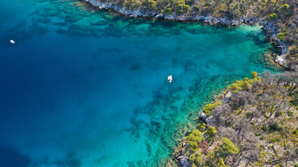Fototapeta na wymiar Aerial drone photo of famous from Mamma Mia movie Three pine cape Amarantos a trully scenic place with crystal clear sea, Skopelos island, Sporades, Greece
