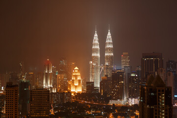 Fototapeta na wymiar Top view of Petronas towers skyline at twilight, night time. Travel Malaysia, Luala Lmpur city centre