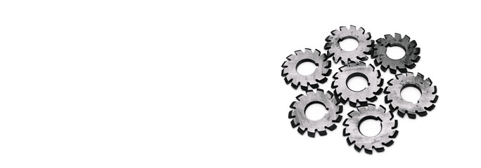 Banner with several metal milling disc cutters for industrial equipment. The tool is isolated on a white background with free copy spase. Close-up