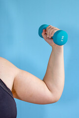 Arm holding dumbbell