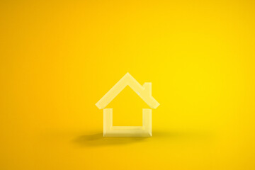 Home Symbol in yellow Background. 3D rendering.