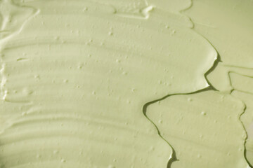 Green cosmetic clay texture close up