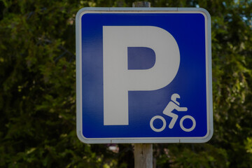 motorcycle parking sign, green background