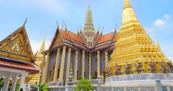 Wat Phra Kaew or Emerald Buddha Temple with blue sky, Tourist famous landmark which relate to religion in Bangkok Thailand. Amazing Thailand travel concept.