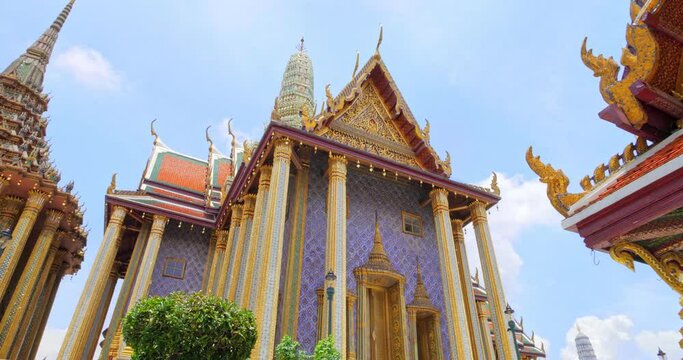 Wat Phra Kaew or Emerald Buddha Temple with blue sky, Tourist famous landmark which relate to religion in Bangkok Thailand. Amazing Thailand travel concept.