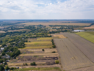 Obraz premium Agricultural village in Ukraine. Aerial drone view.
