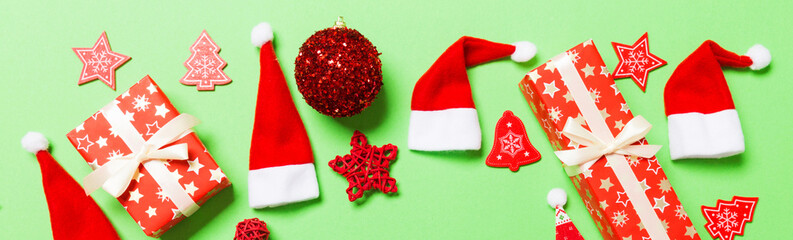 Top view of Banner Christmas decorations on green background. New Year holiday concept with copy space