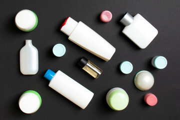 Group of plastic bodycare bottle Flat lay composition with cosmetic products on colored background empty space for you design. Set of White Cosmetic containers, top view with copy space