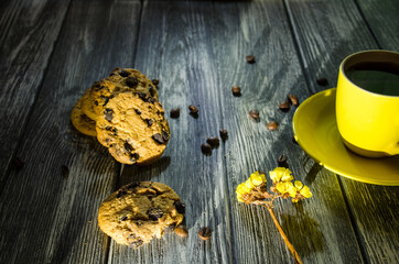 Still life with cup of coffee and chocolate cakes on the grey background