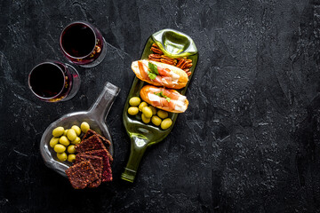 Antipasto and red wine in glasses top-down copy space