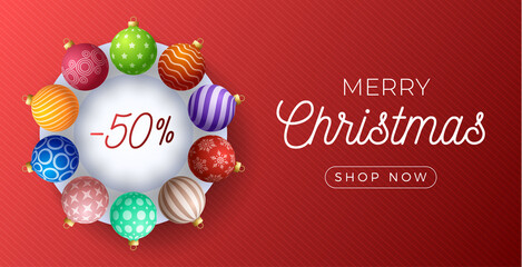 Fototapeta na wymiar Christmas horizontal sale promo banner. Holiday vector illustration with realistic ornate colorful Christmas balls on red background.