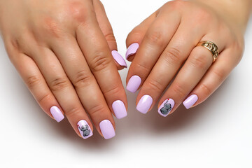 Gel nails. Close up of gray manicure with painted gray elephants and a red heart on short square nails on a white background.