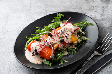 Close up of bell pepper and aubergine rolls, baked and stuffed with young cheese