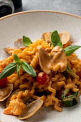 Appetizing photo of seafood pasta with alfredo sauce, close up, restaurant photography