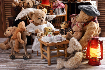 vintage teddy bear family sitting at the tea table
