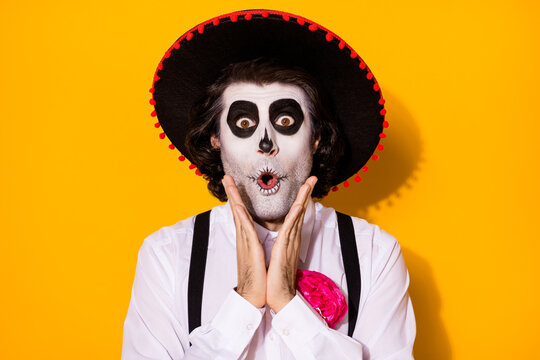 Photo of spooky scary ghost guy hands cheekbones impressed find potion become invisible festival trick wear white shirt death costume sugar skull suspenders isolated yellow color background