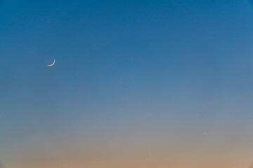 Crescent Moon, Venus and Mercury in Blue Sky