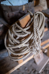Heap of old hemp rope in dark warehouse
