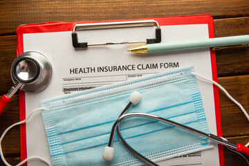 Health insurance claim form with surgical mask