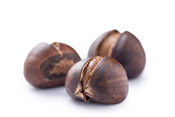 Delicious peeled roasted chestnuts isolated on white background.