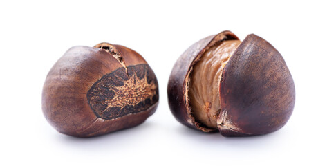 Delicious peeled roasted chestnuts isolated on white background.