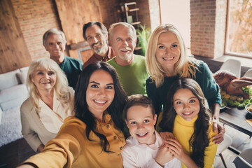 Closeup portrait photo of full family gathering eight people cuddle embrace hold hands finish...