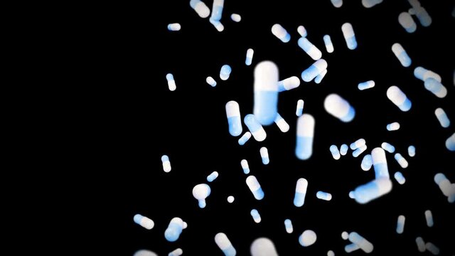 Flying many medical capsules on black background. Medicine and pharmaceutical concept. 3D animation of blue pill capsule rotating. Loop animation.
