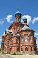 Fototapeta na wymiar St. Nicholas and St. George Church (Nikolskaya Georgievskaya church, 1894, eclectic, pseudo-Russian style). Smogiri village, Smolensk Oblast, Russia.