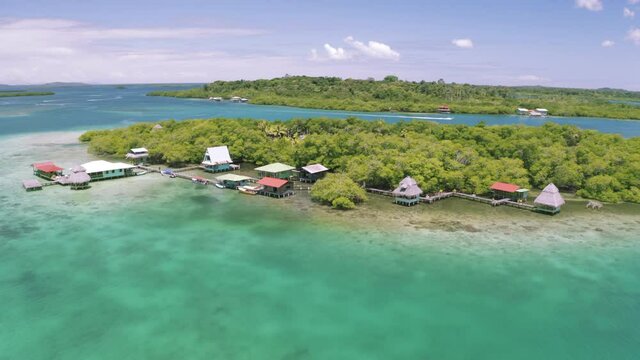 Aerial drone view of the overwater floating houses and boats in the mangroves of the Islands of Bocas del Toro, Panama