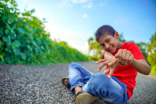 indian child playing with stone