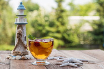 Summer dessert on wooden table with holidays elements.