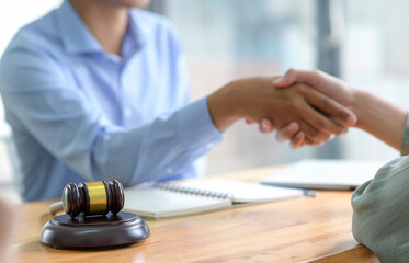 Close-up shot of Shaking hands when reaching a legal agreement.