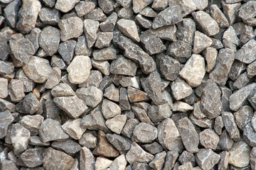 small road stone background, dark gravel pebbles stone texture. Closeup top view gravel. Gravel in garden. Pattern