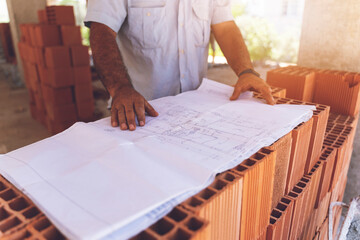 Engineer working on project documentation at a construction site.