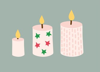 set of Christmas candles. Three beige candles are decorated with red and green stars, stripes and dots. cartoon vector illustration isolated on green background.